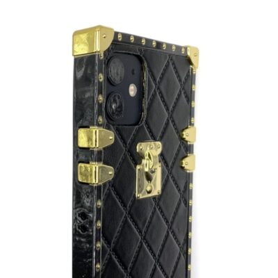 Photo de la coque Dubaï noire et or en forme de malle Louis Vuitton pour la protection des iPhone